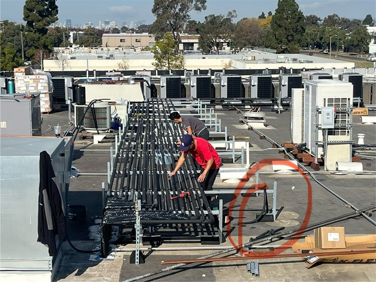 Commercial piping installation on rooftop